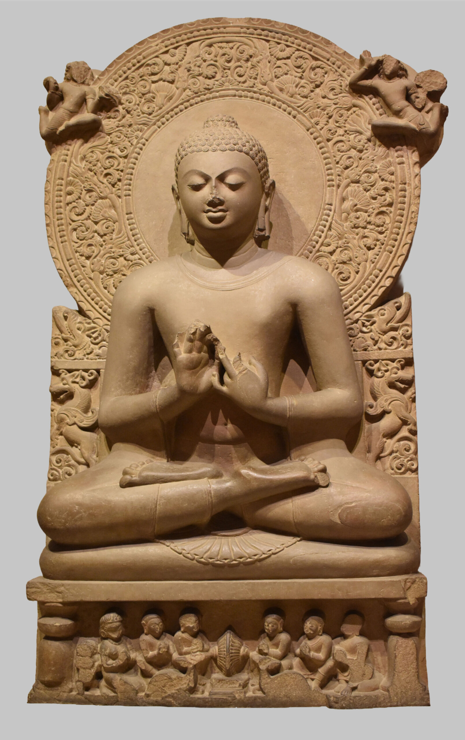 Photograph of a 5th century seated sandstone Buddha in dharmachakra mudra from Sarnath