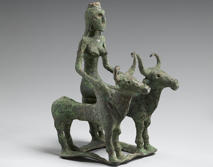 Woman Riding Two Brahman Bulls