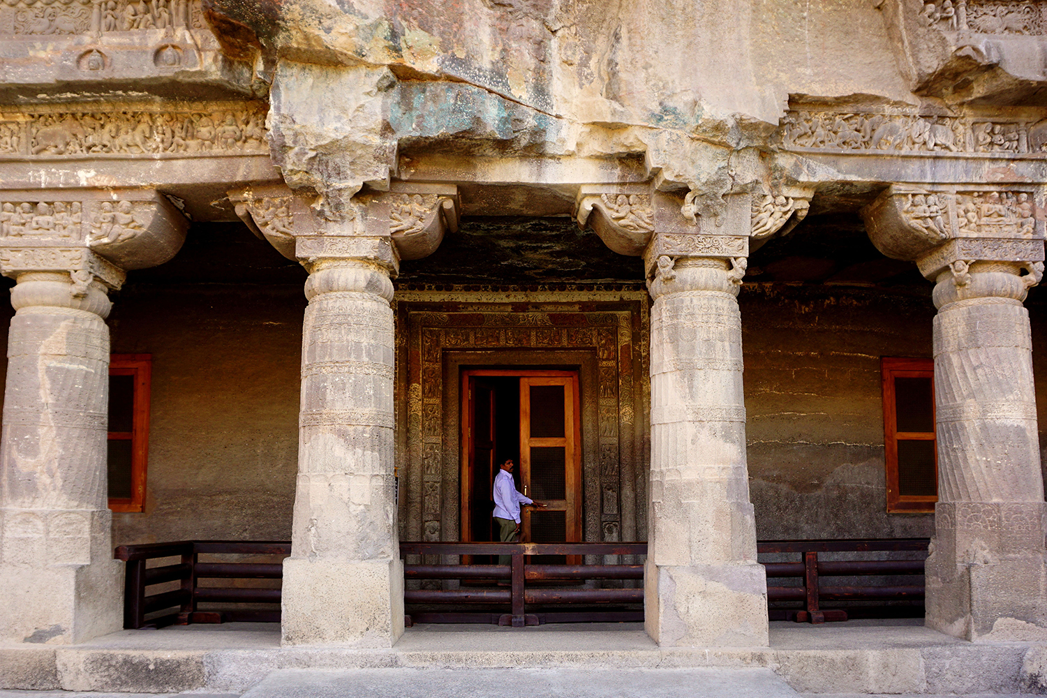Photograph of the front facade of Ajanta Cave 1 showing four columns and entrance