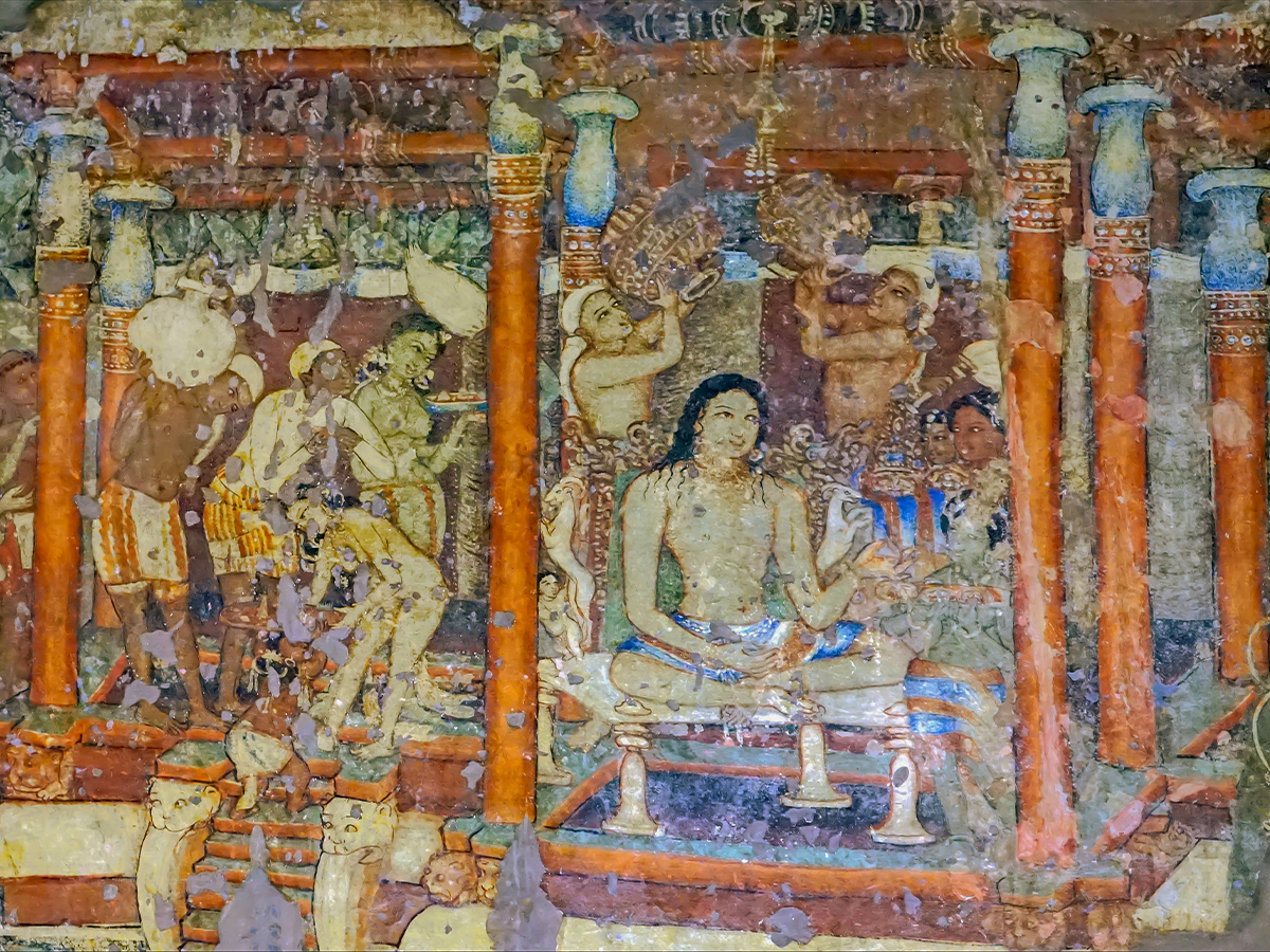 Photograph of a mural in Ajanta Cave 1 showing a seated kingly figure having a ceremonial bath while attendants look on, based on the Sibi Jataka