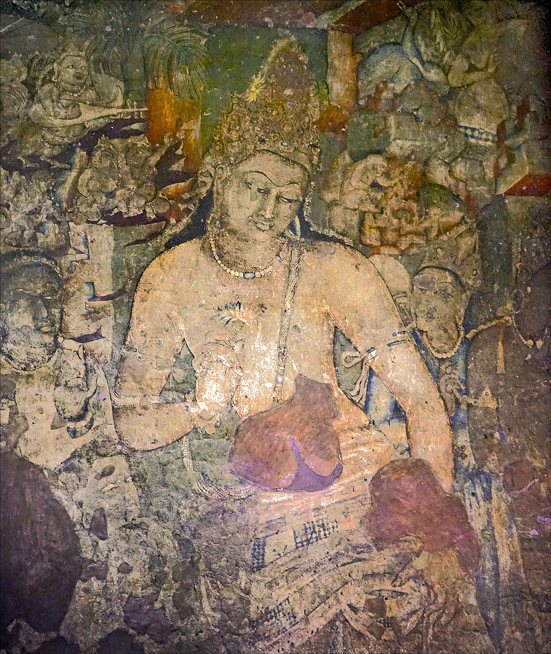 Photograph of a mural in Ajanta Cave 1 showing Avalokiteshvara Padmapani holding a white lotus in his right hand