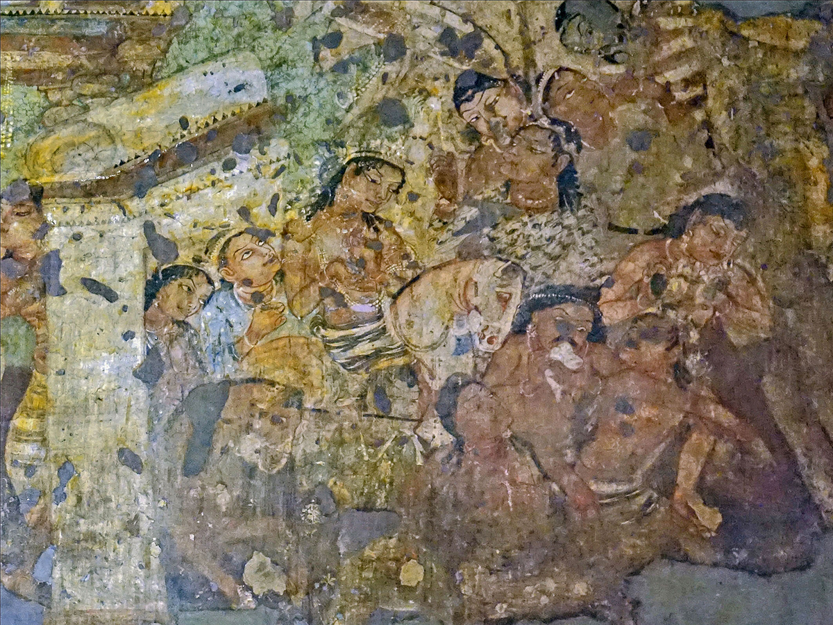 Photograph of a mural in Ajanta Cave 1, showing a kingly figure seated on a white horse surrounded by attendants