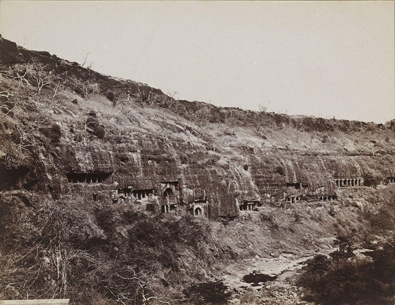 19th-century monochrome photograph of a hillside landscape showing the Ajanta Caves, by Francis Frith & Co.