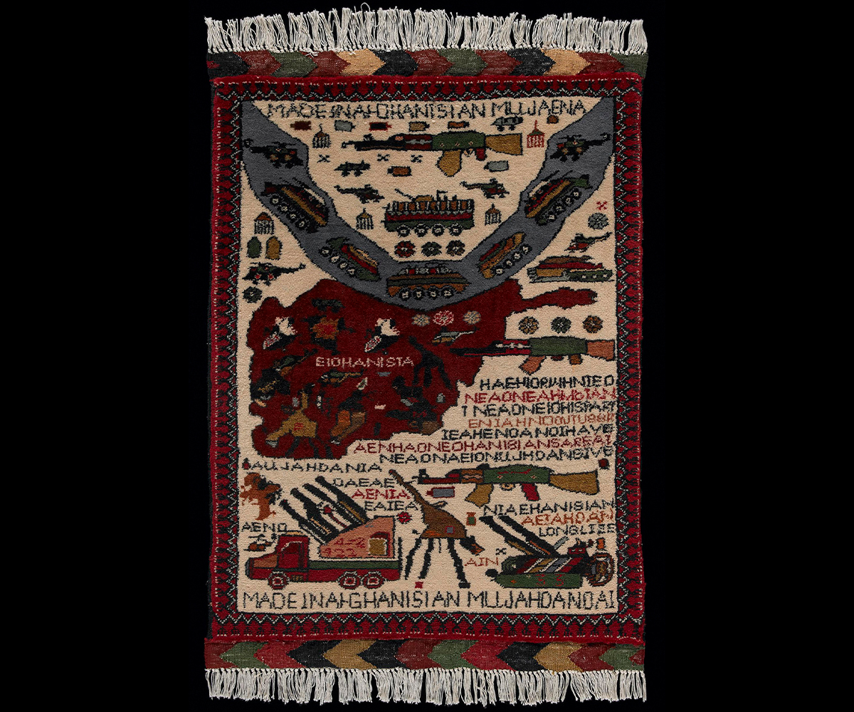 Cream and burgundy rug showing map of Afghanistan with weapons pointing at armoured vehicles and helicopters leaving along a curving river