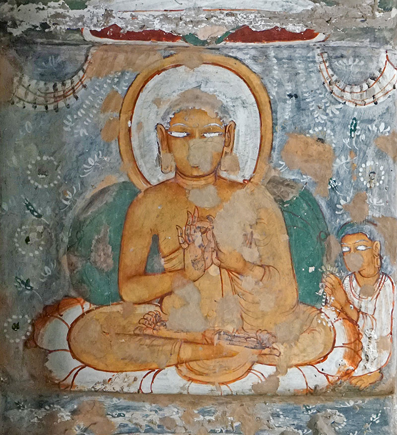 Photograph of a mural in Ajanta Cave 10 showing a seated Buddha in the Dharmachakra Mudra, with one devotee