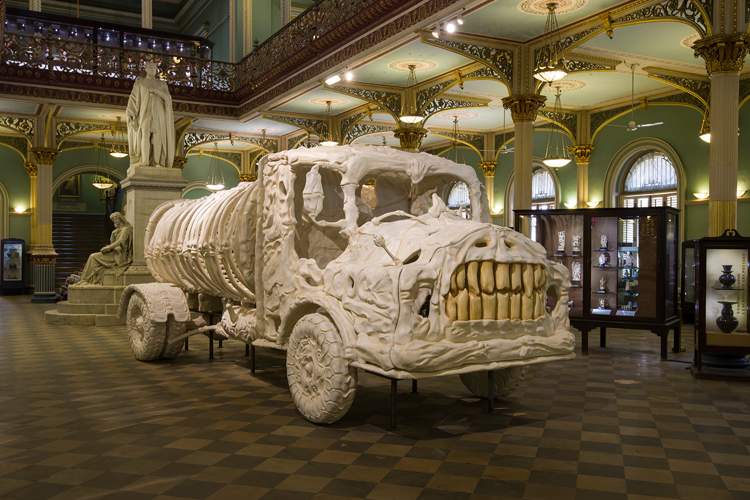 Mixed-media sculpture 'Aquasaurus' by Jitish Kallat, showing a truck appearing to be made from bones and teeth