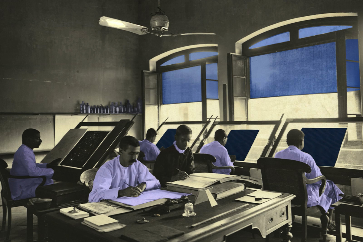 Photograph of a looped video projection titled An Afternoon Unregistered on the Richter Scale by Raqs Media Collective showing an archival photograph of a room full of surveyors