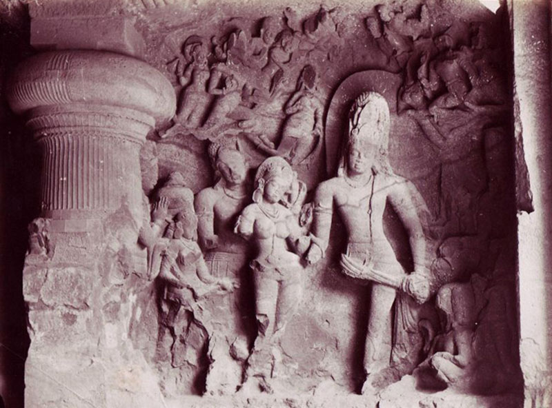 Late 19th-century black and white photograph of the Kalyanasundara relief sculpture at Elephanta Cave 1 with round pilaster on left