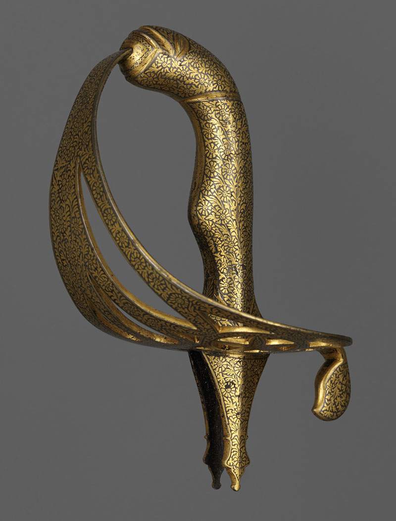 Photograph of a late-18th-century sword hilt of iron or steel with gold koftgari