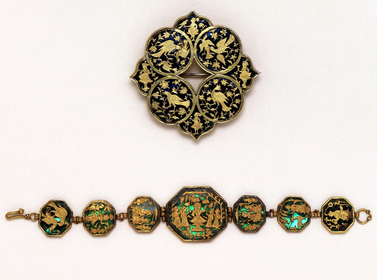 Photograph of a brooch with blue glass, and a bracelet with 7 plaques of green glass, with thewa showing birds and figures including Shrinathji