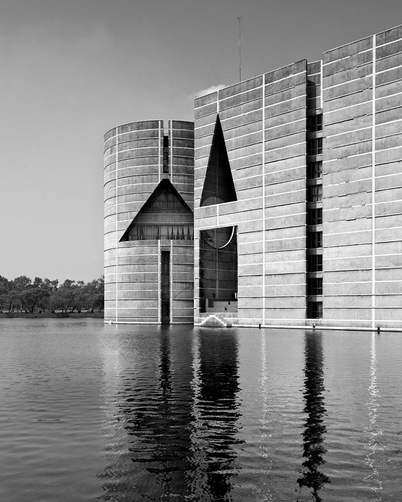 Photograph of a corner of National Assembly Building, Dhaka against surrounding lake