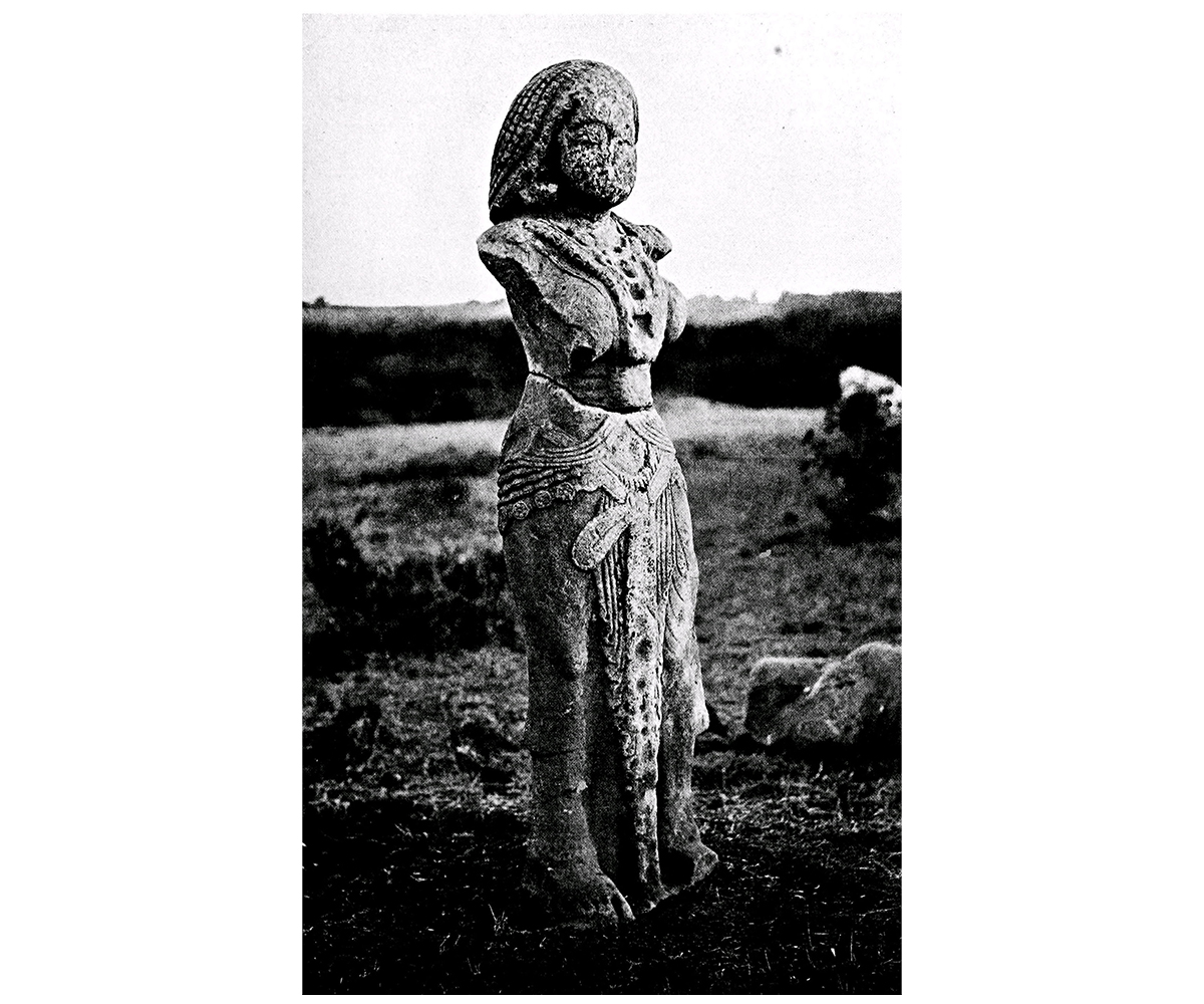 Black and white photograph of the Besnagar yakshi as it was found
