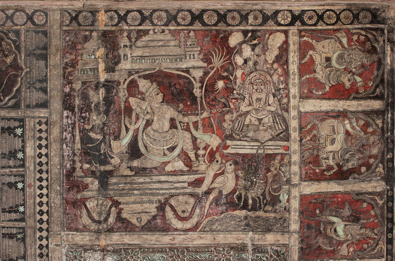 Photograph of the ceiling mural at Virupaksha Temple showing a male figure shoot an arrow