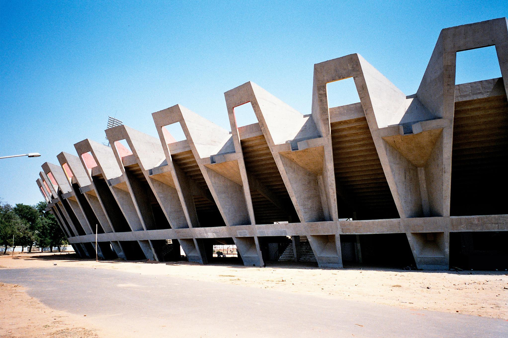Photograph of the exterior view of the Sardar Vallabhbhai Patel Stadium in Ahmedabad designed by Charles Correa and Mahendra Raj