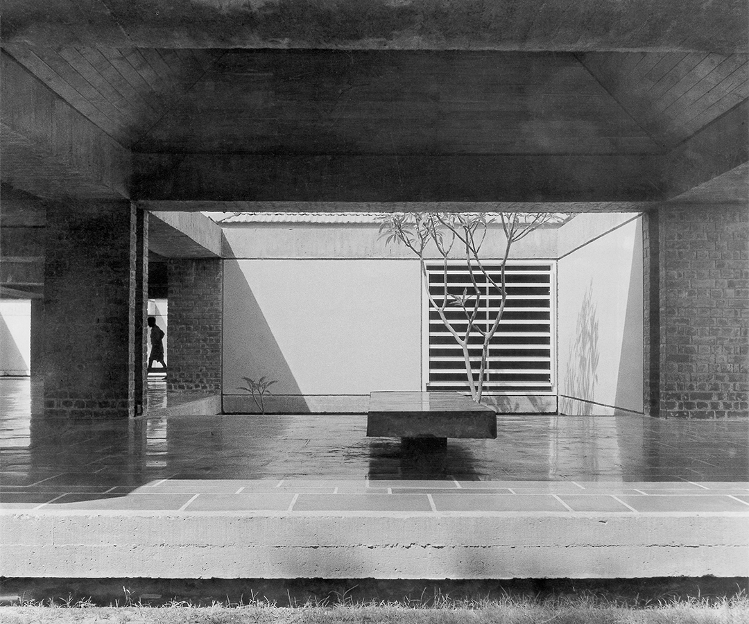 Photograph by Pranlal Patel of one of the corridors at the Gandhi Smarak Sangrahalay with a bench