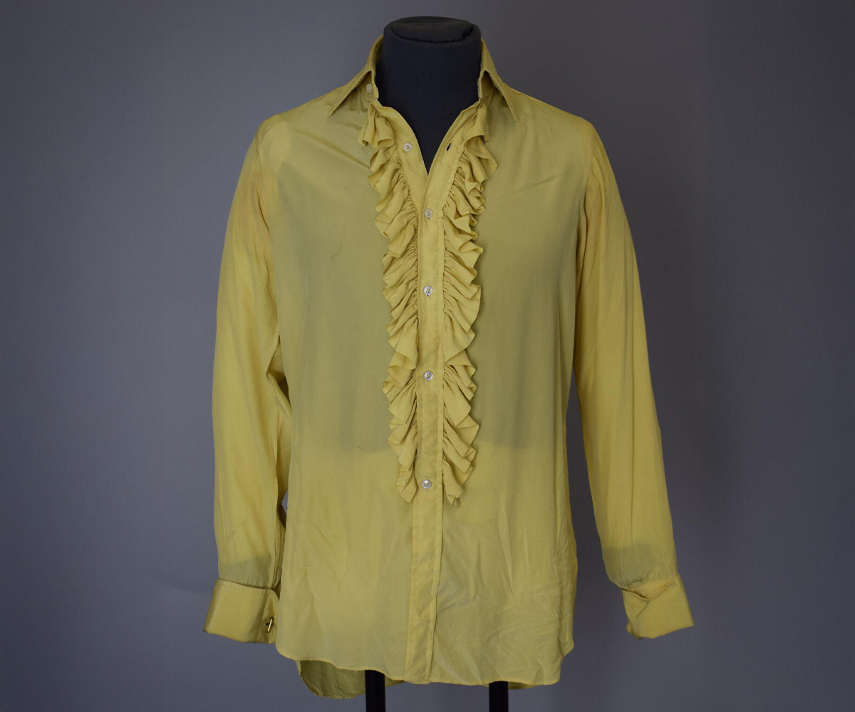 Photograph of a yellow ruffled crêpe-de-Chine shirt made by Turnbull & Asser Ltd