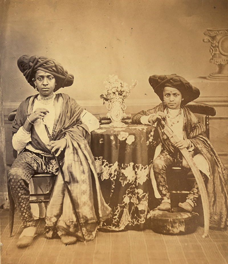 Mid-19th century photograph by Hurrychand Chintamon showing two seated Maratha boys from Akalkot