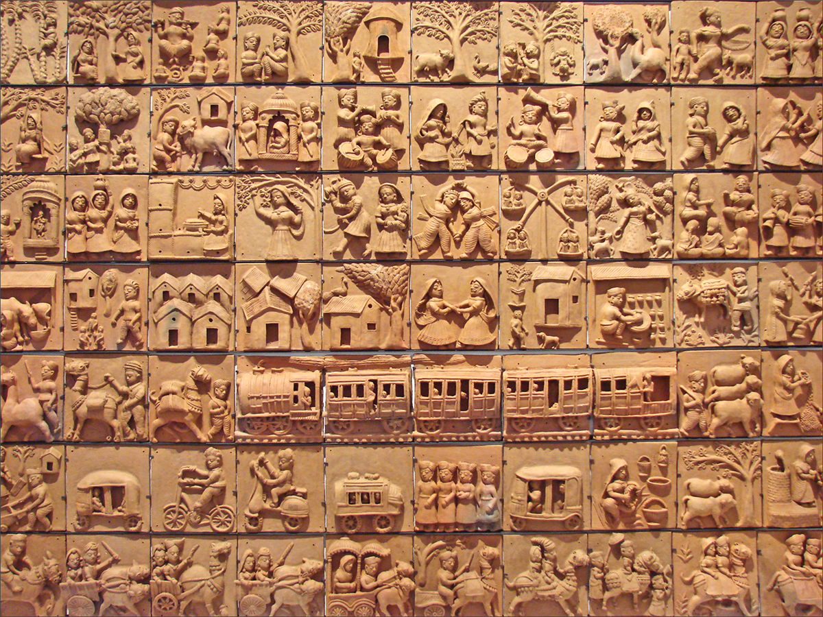 Photograph of various Molela plaques displayed at the Quai Branly Museum in Paris