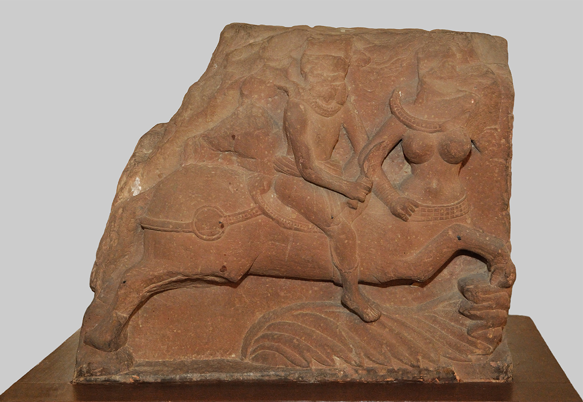 Photograph of a Kushana period kinnara mithuna sculpture showing a man and a woman depicted as half-human and half-horse