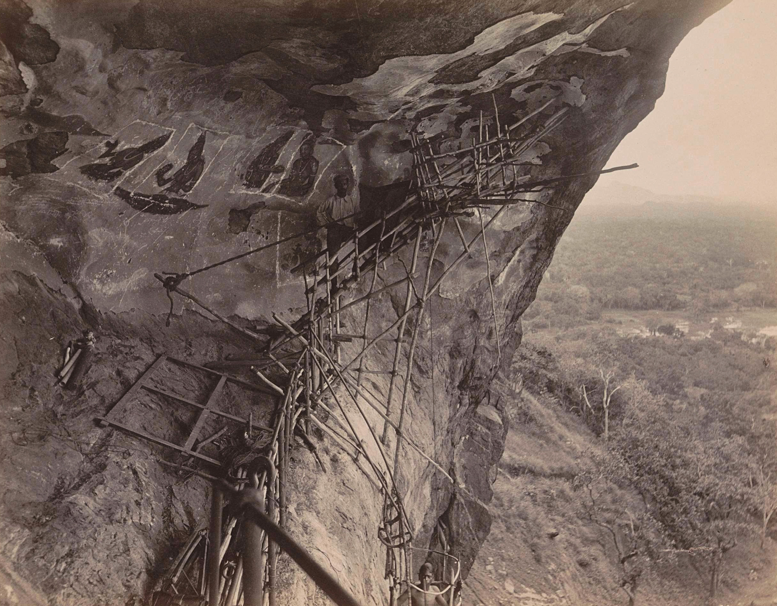 Archival photograph of some of the Sigiriya frescoes with scaffolding