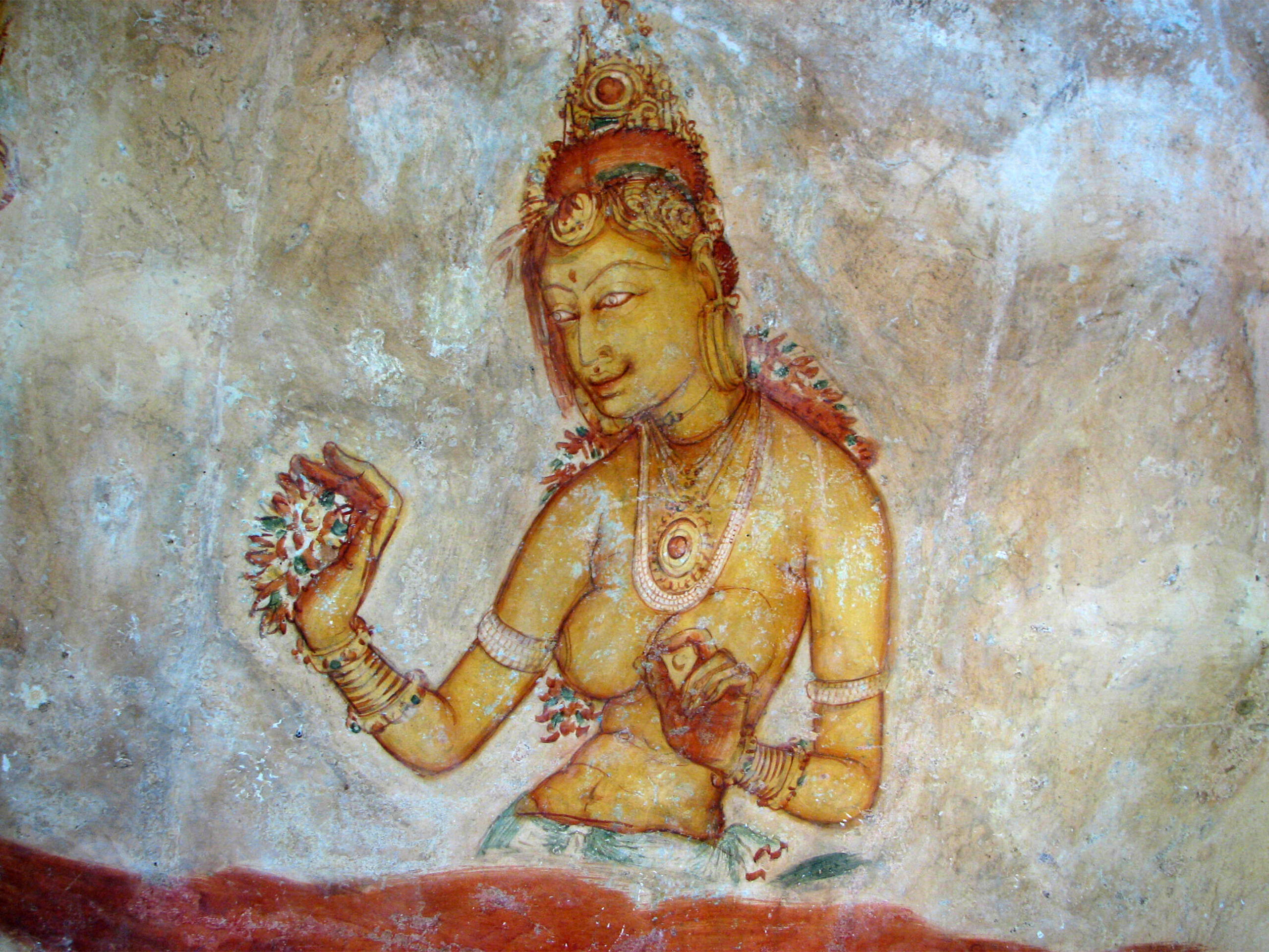 Photograph of a Sigiriya mural showing a bare-bodied, heavily bejewelled lady