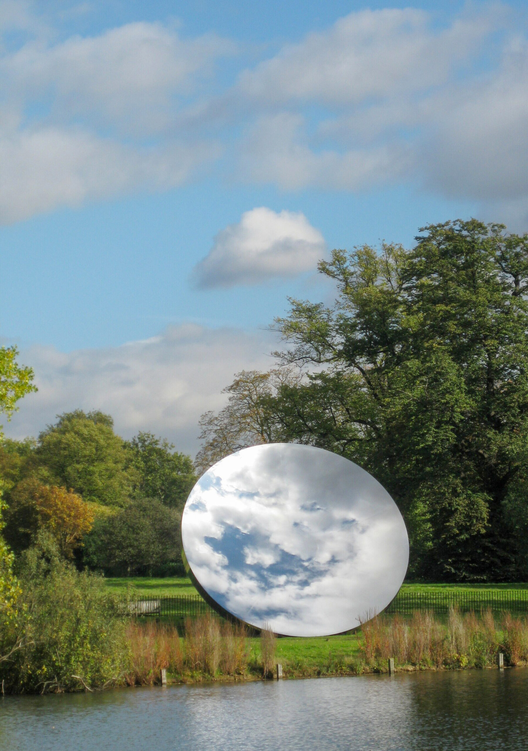 Photograph of the installation titled Sky Mirror by Anish Kapoor