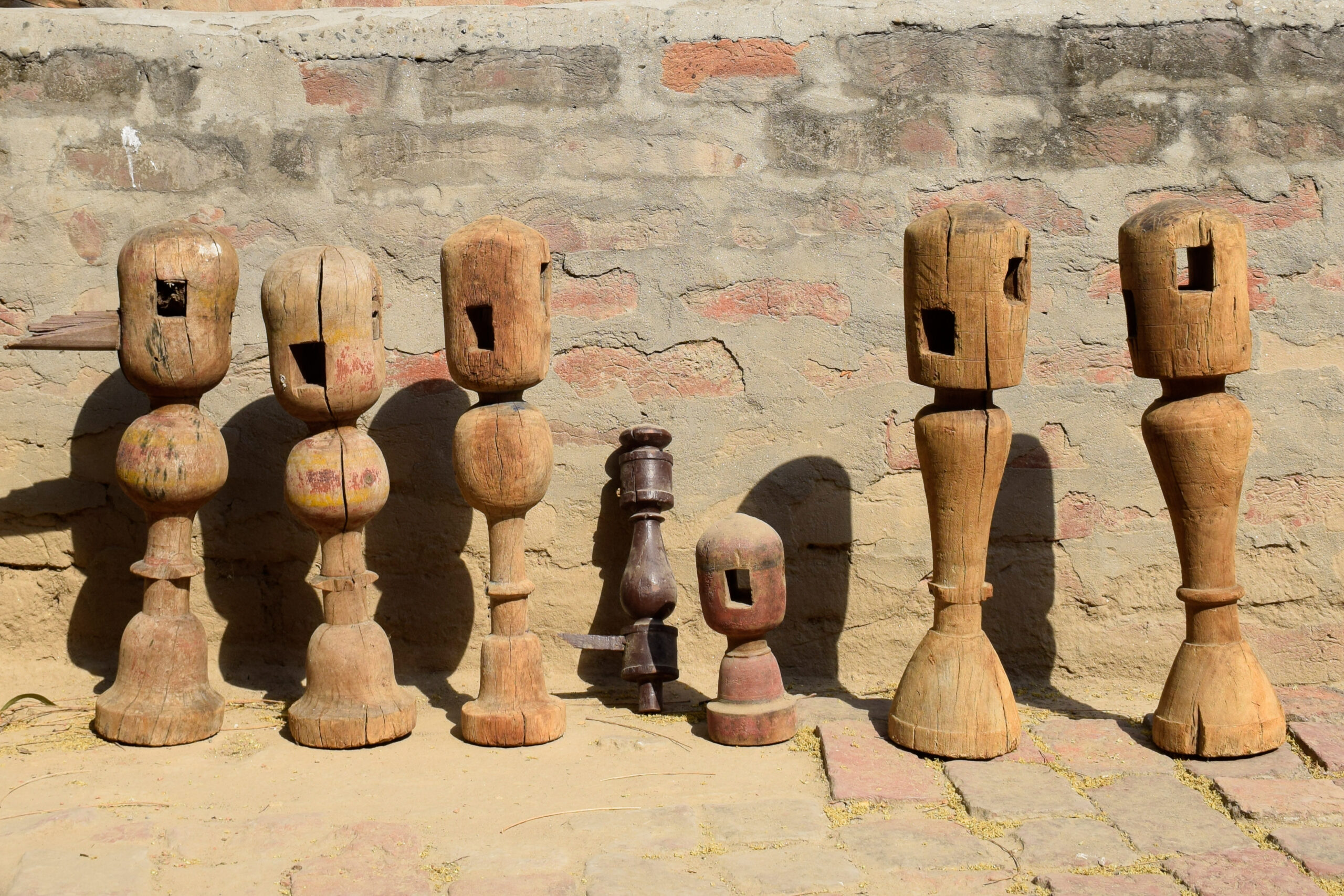 Photograph of various turned and lacquered wooden legs used for charpoys in Punjab and Haryana