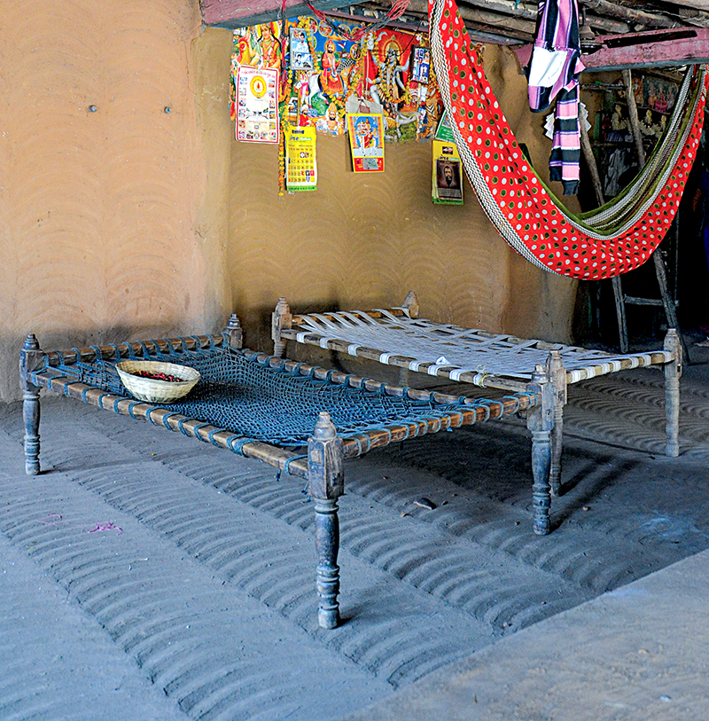 Photograph of two khatlos kept side by side one with a surface woven from rope (L) and the other from cotton straps (R)