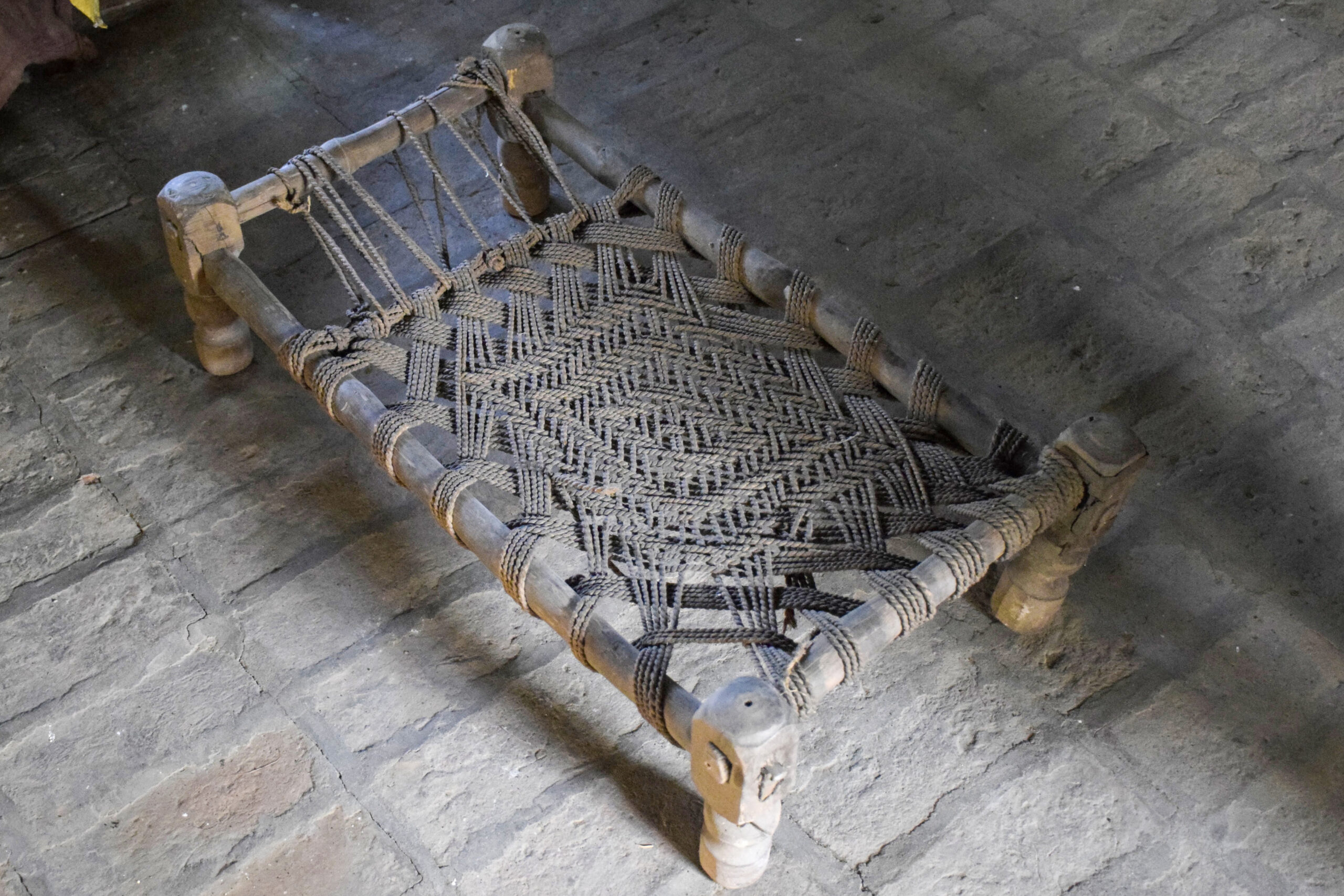 Photograph of a manji woven with webbing made of munjh ropes