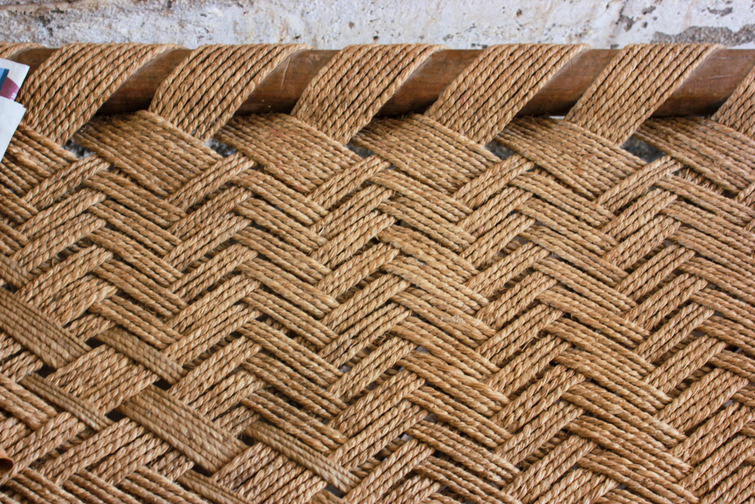 Photograph showing the edge of a gherewadi macha with the webbing made of munjh