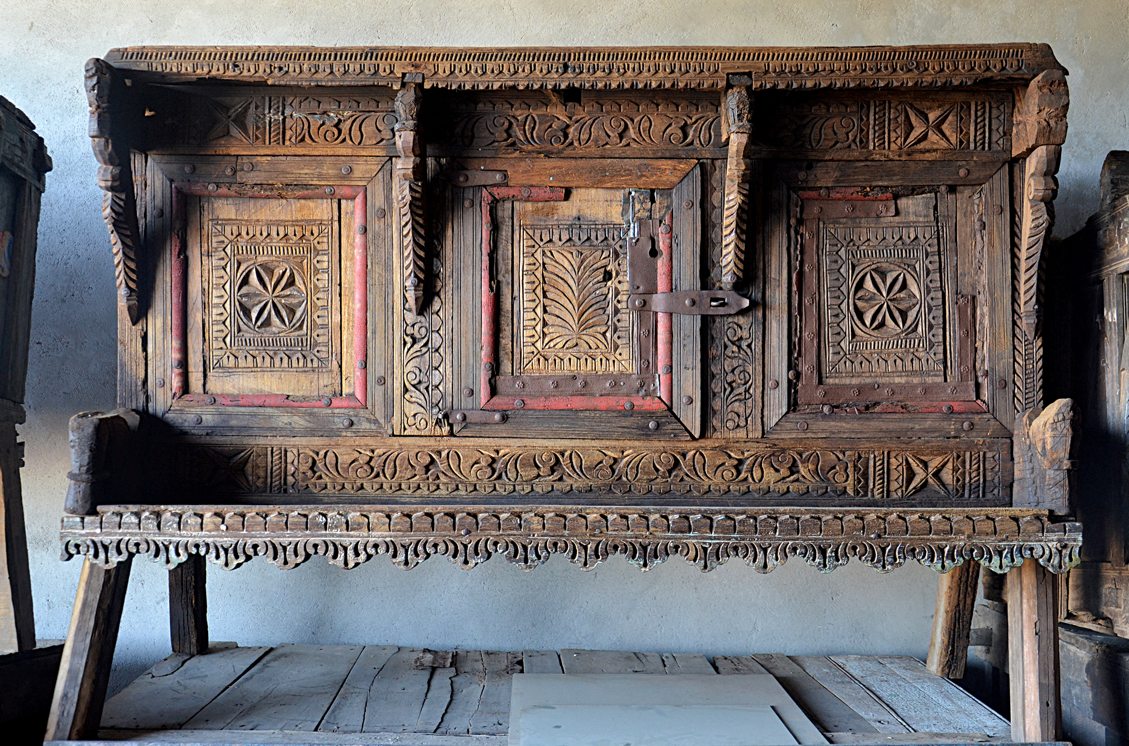 Photograph of an intricately carved majus at a warehouse in Limdi