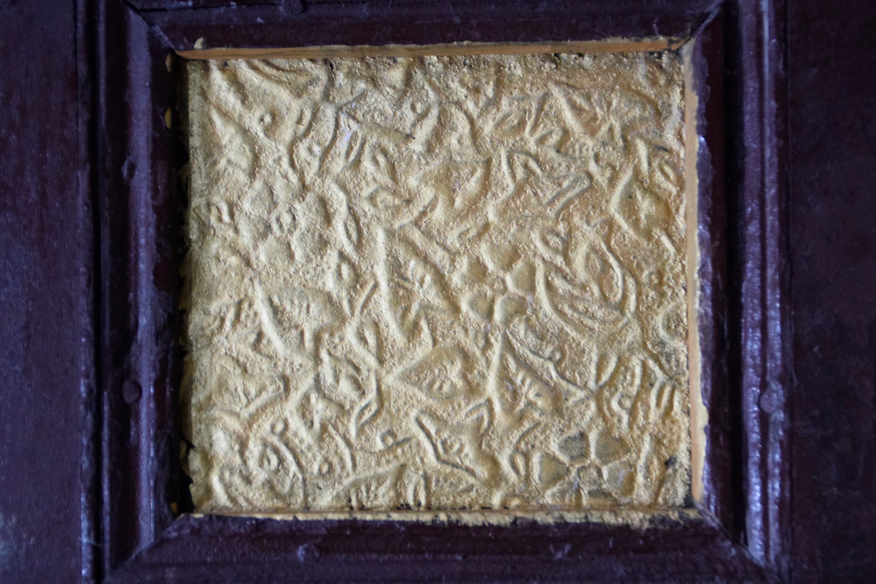 Photograph of an embossed metal sheet used as a decorative element on the surface of a sandook