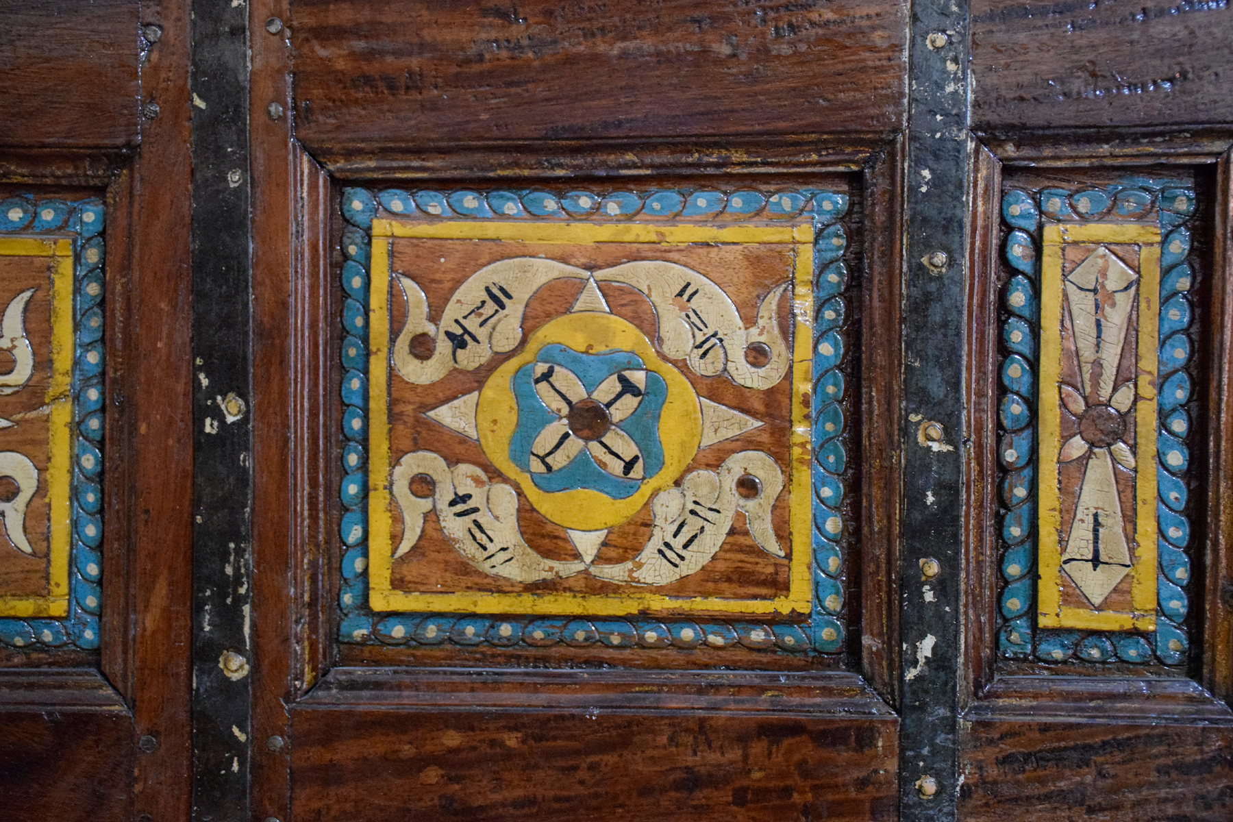 Photograph of a painted wooden panel on a sandook