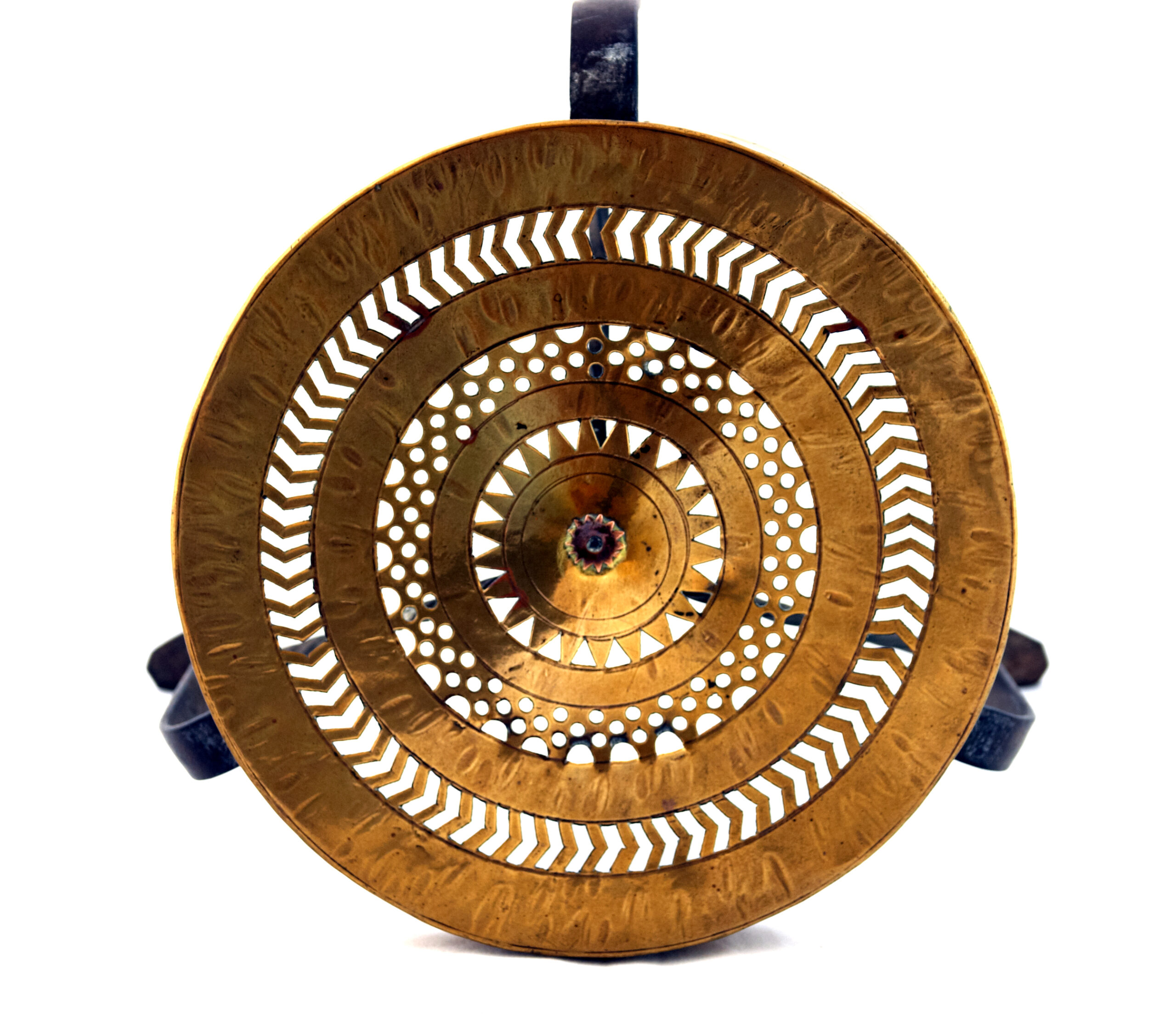 Photograph showing the top view of a tarpai with a distinctive chevron piercing pattern