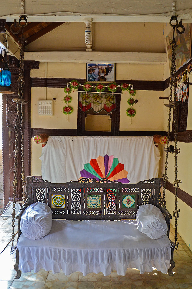 Photograph of a swing with a backrest known as hichko in a veranda at the darbargadh of Katar