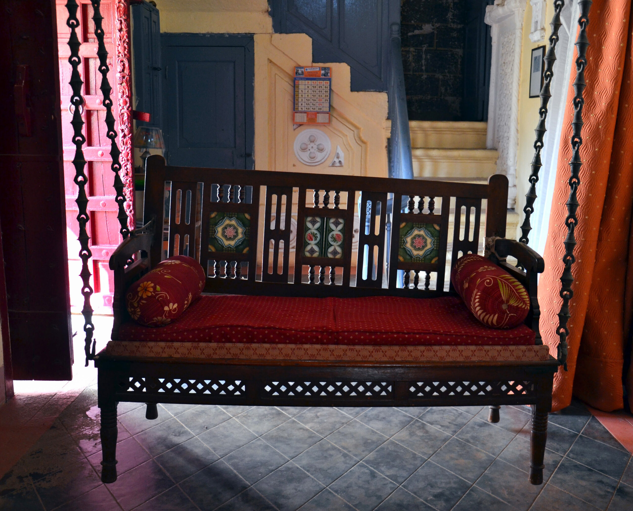 Photograph of a swing with a backrest known as hichko in the living room of a house in Devpar