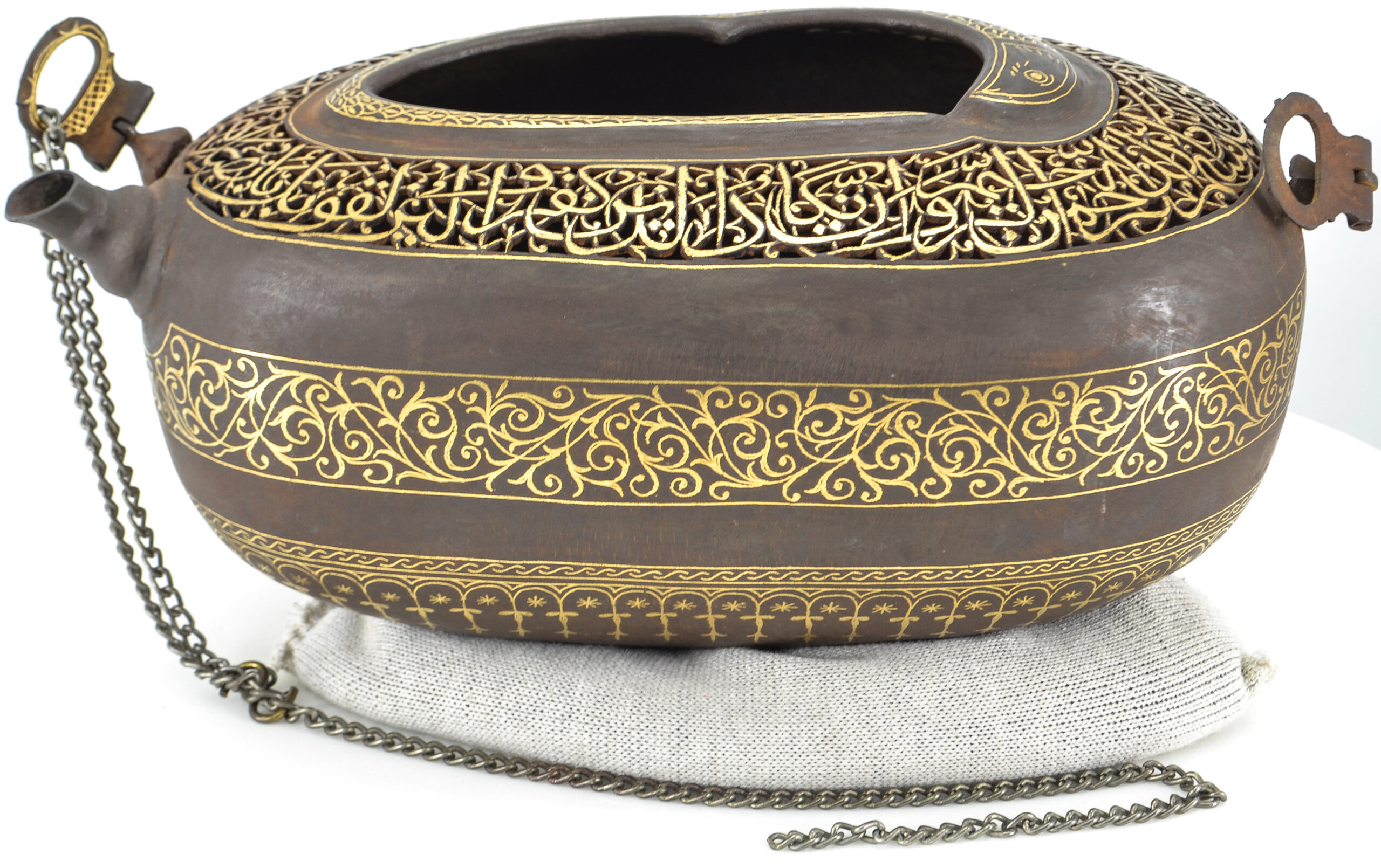Photograph of a late 19th to early 20th century steel kashkul with gold damascene from Iran