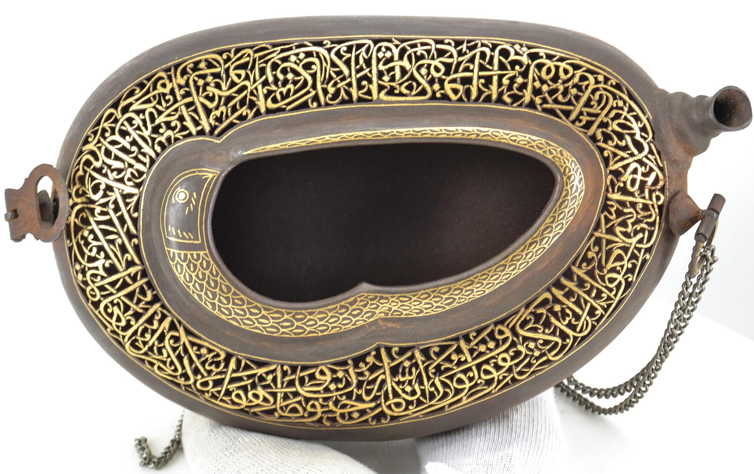 Photograph of a late 19th to early 20th century steel kashkul with gold damascene from Iran
