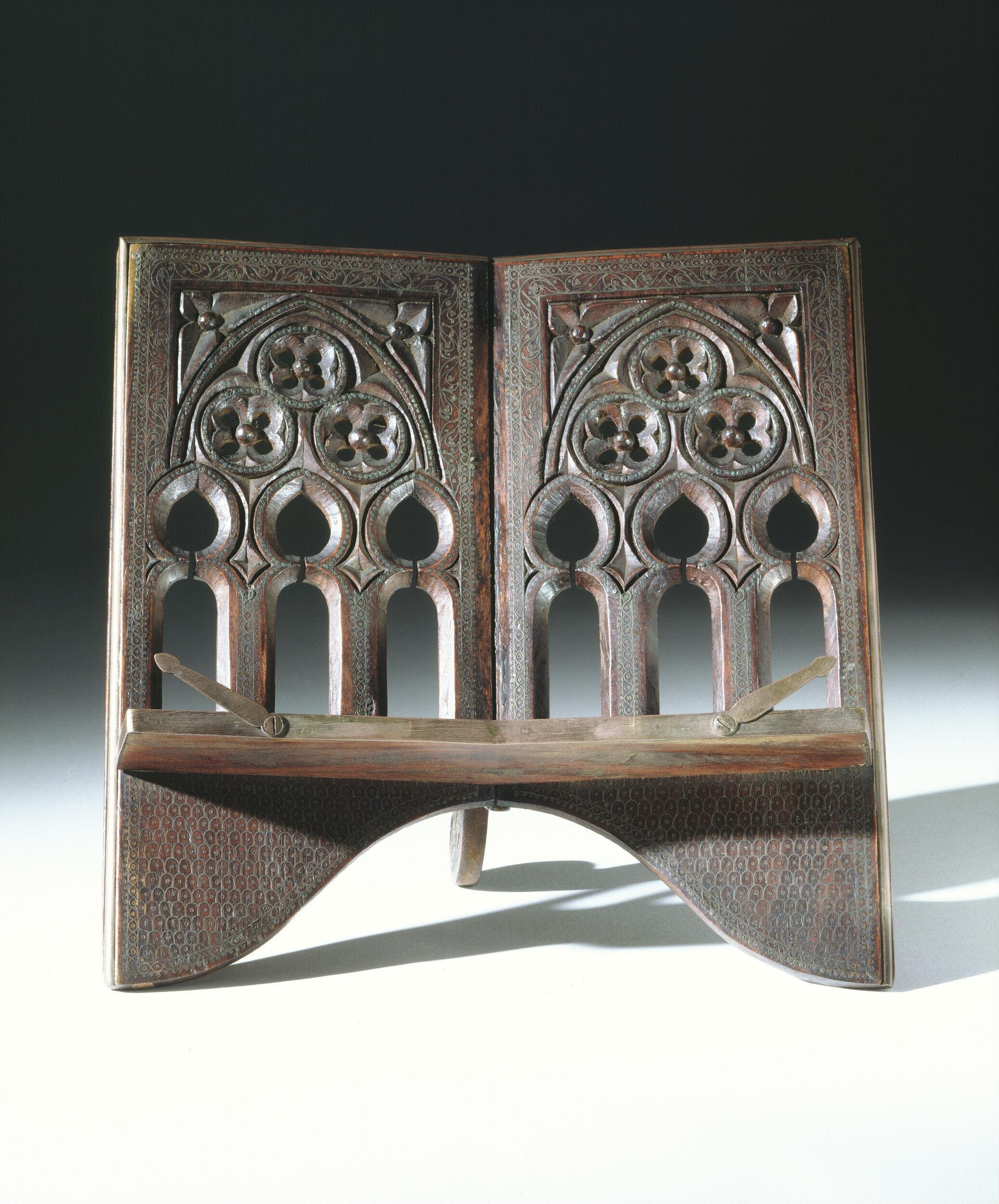 Photograph of a late 19th to early 20th book rest from Manipur made out of shisham wood and inlaid with brass wire
