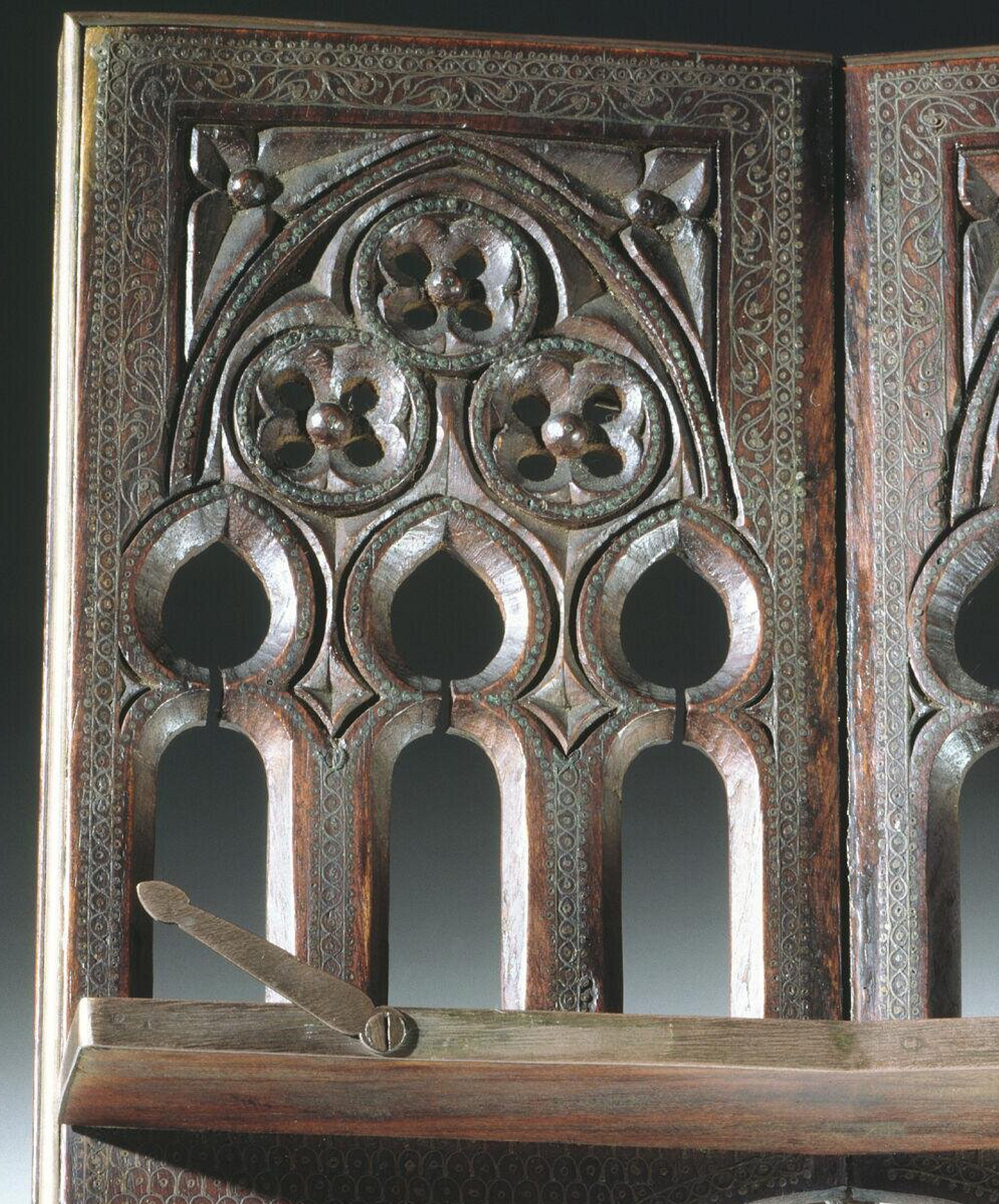Photograph of a late 19th to early 20th book rest from Manipur made out of shisham wood and inlaid with brass wire