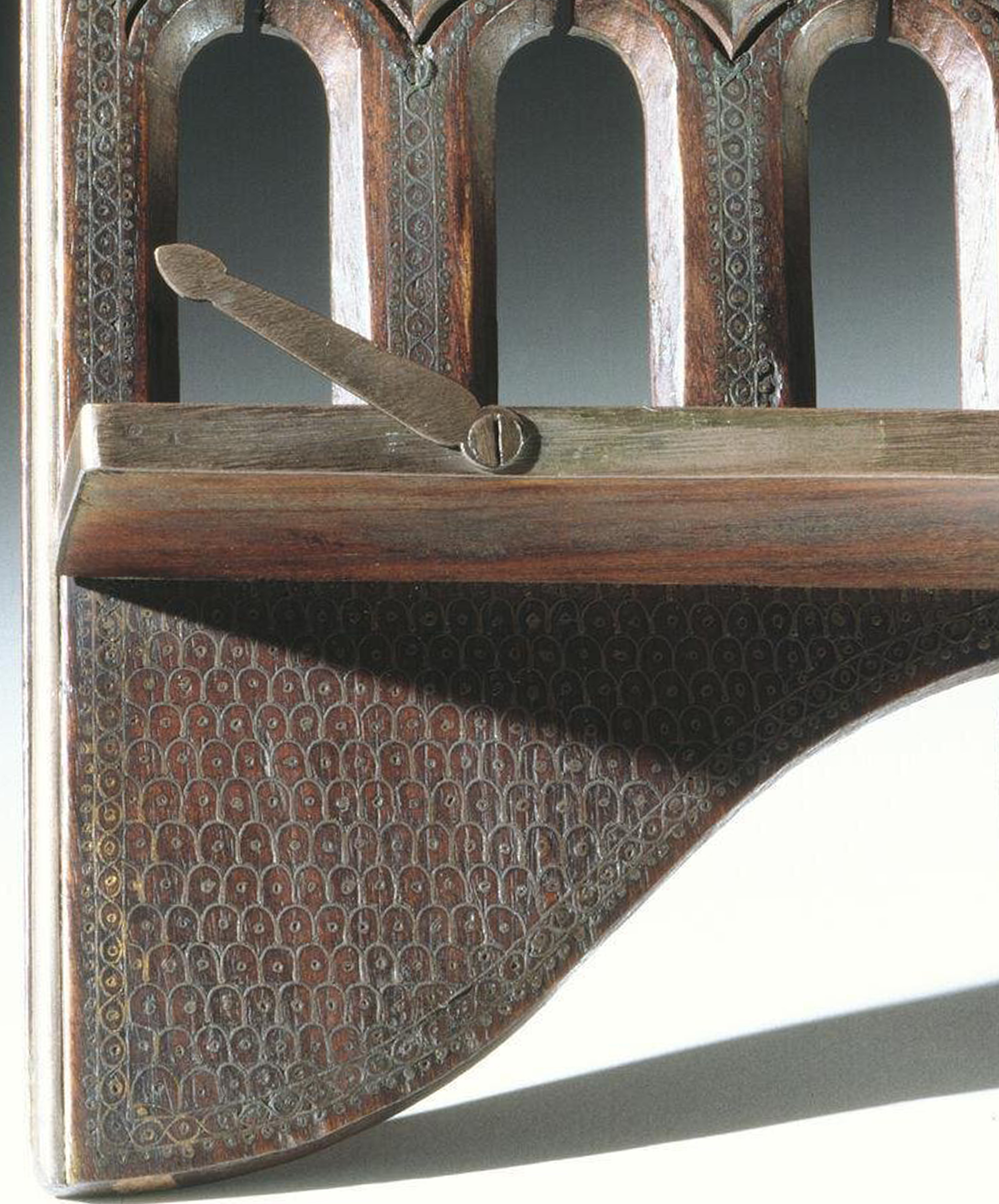 Photograph of a late 19th to early 20th book rest from Manipur made out of shisham wood and inlaid with brass wire
