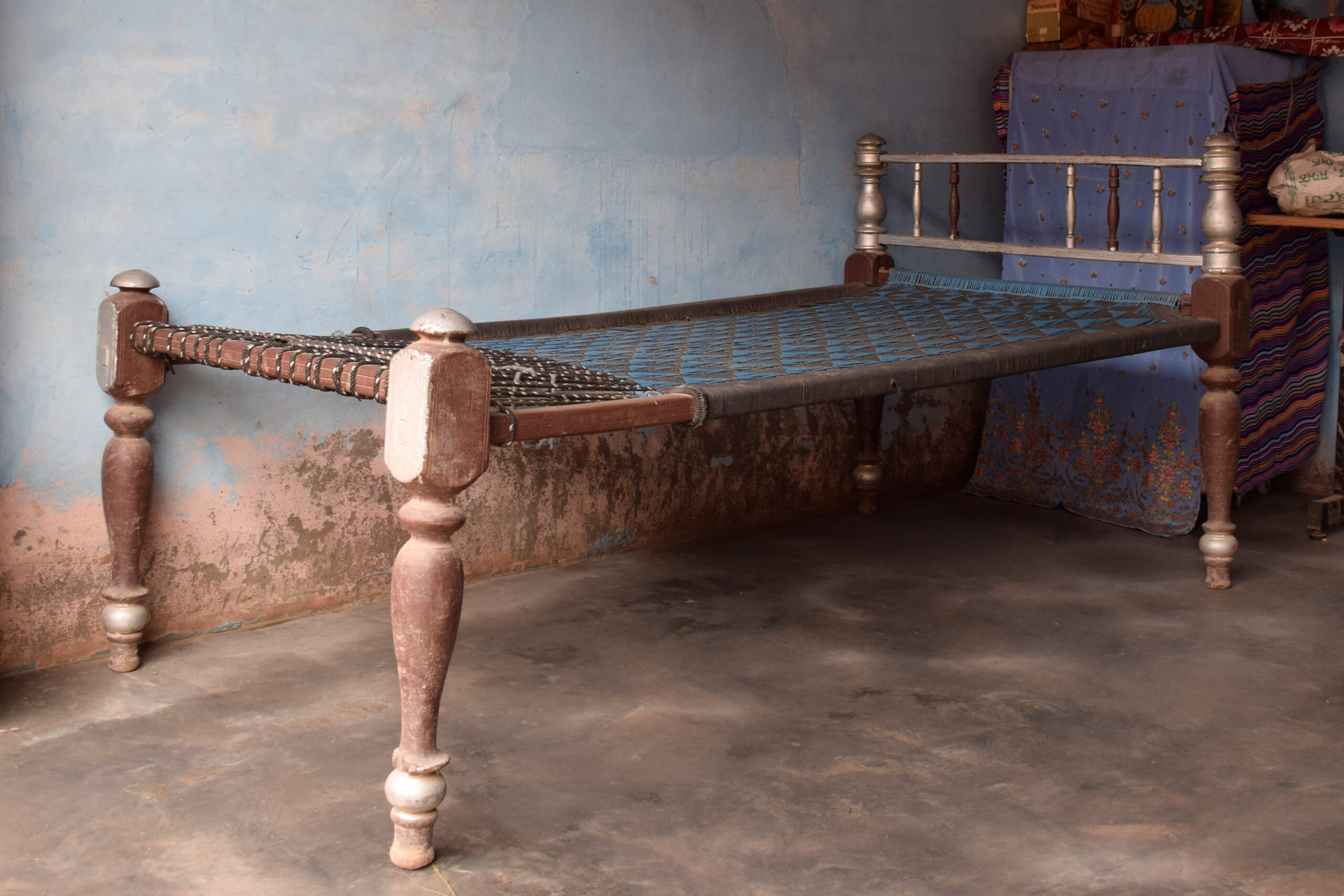 Photograph of a wooden palang belonging to Manjeet Kaur