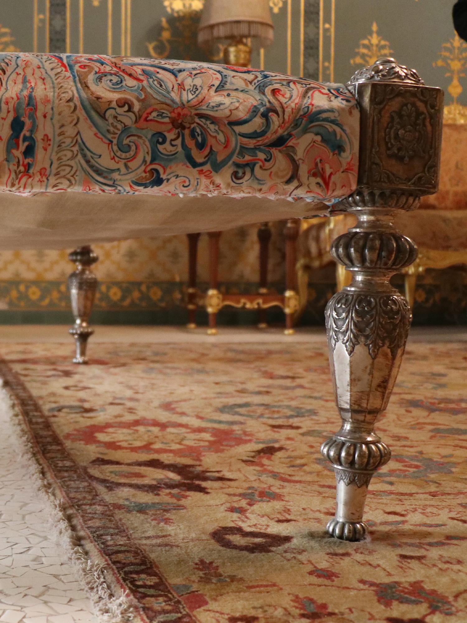 Photograph of a palang with its wooden legs clad in silver from Bikaner, Rajasthan