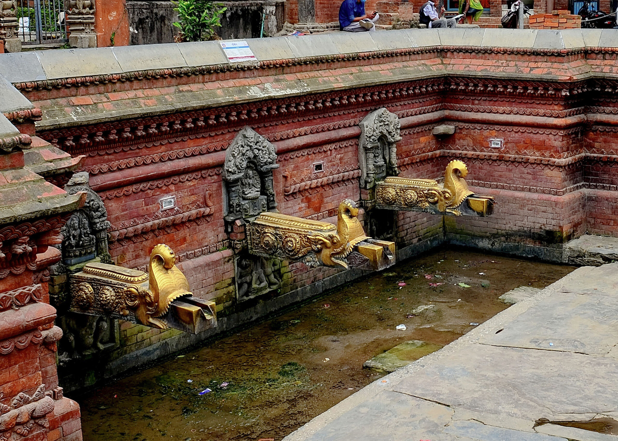 Photograph of three spouts of the Sundhara hiti or Lho hiti in Lalitpur, Nepal