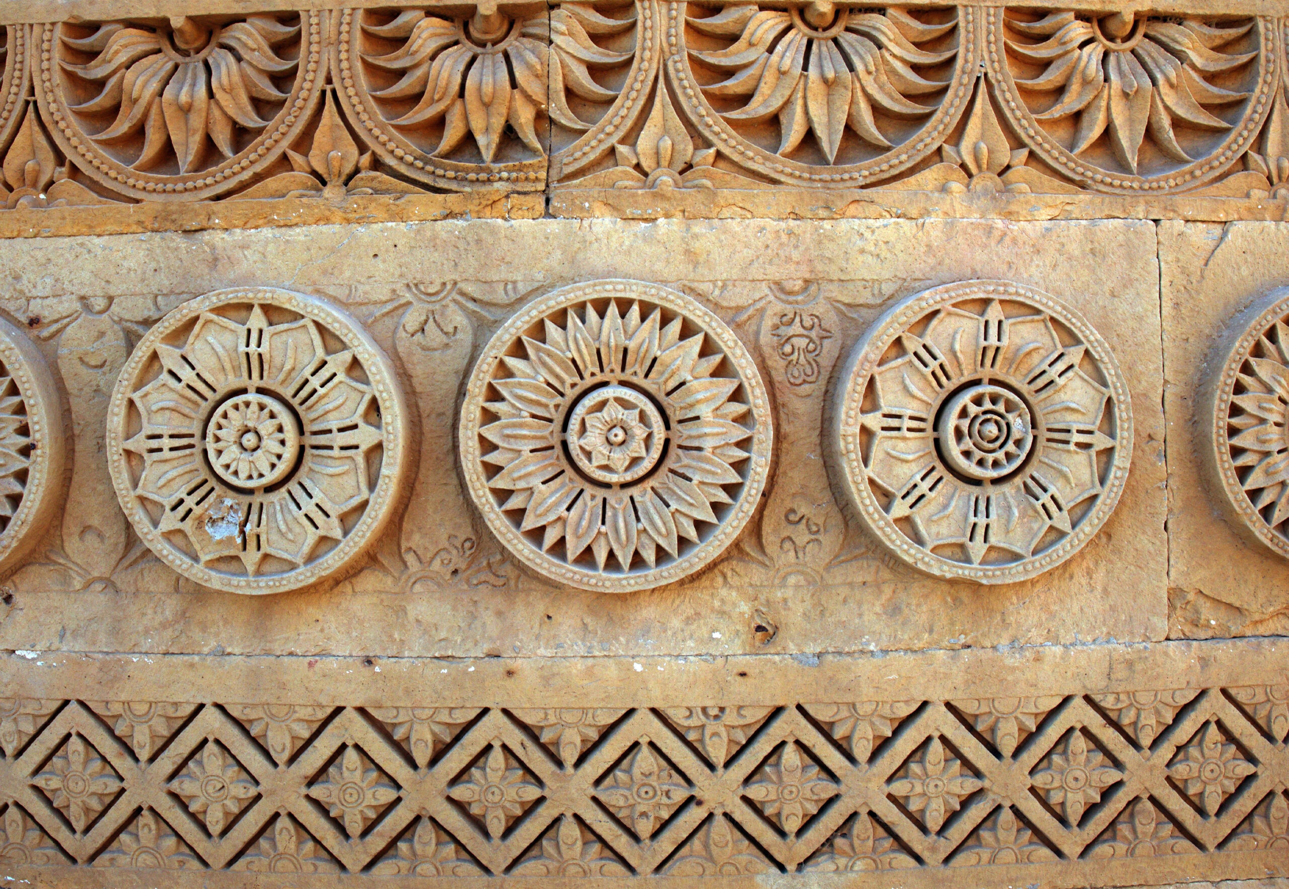 Photograph showing a deatiled view of the rosette motifs on the tomb of Nizamuddin II at Makli Necropolis