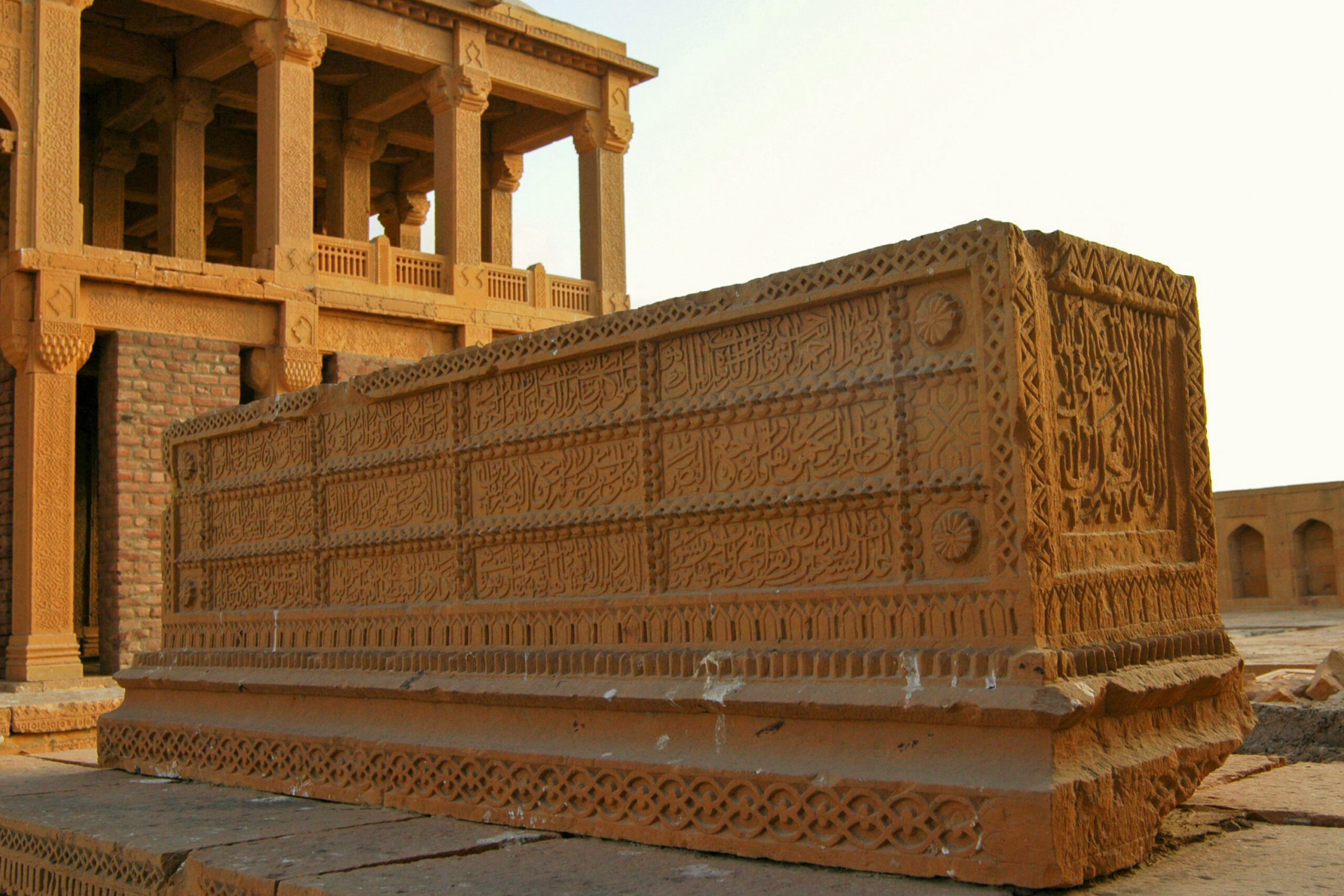 Photograph of a sarcophagus at the tomb of Isa Khan Tarkhan II with Quranic verses inscribed on them at the Makli Necropolis